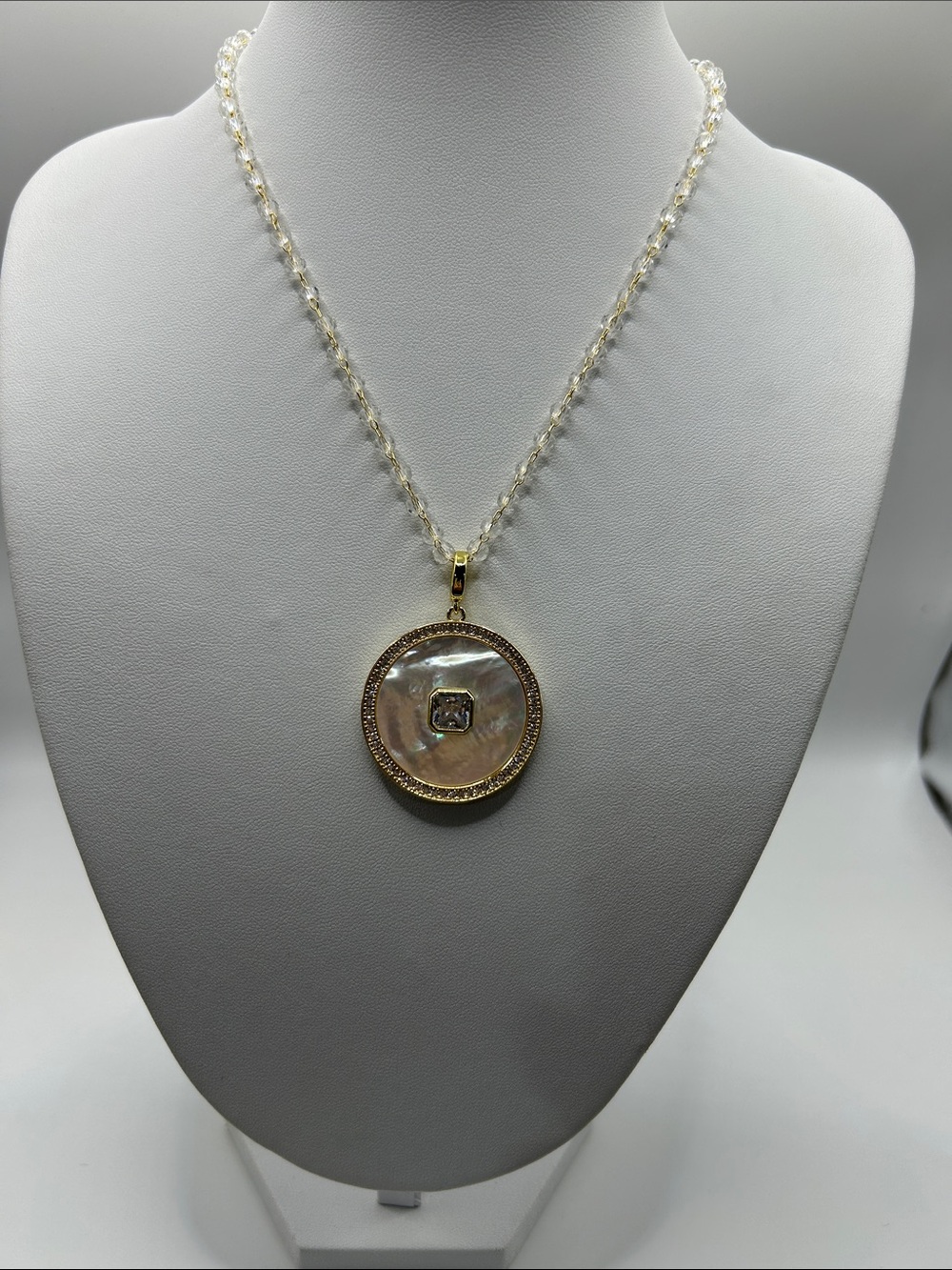 1453. Gold Tone and Mother-of-Pearl Pendant Necklace - 16” - 18”.